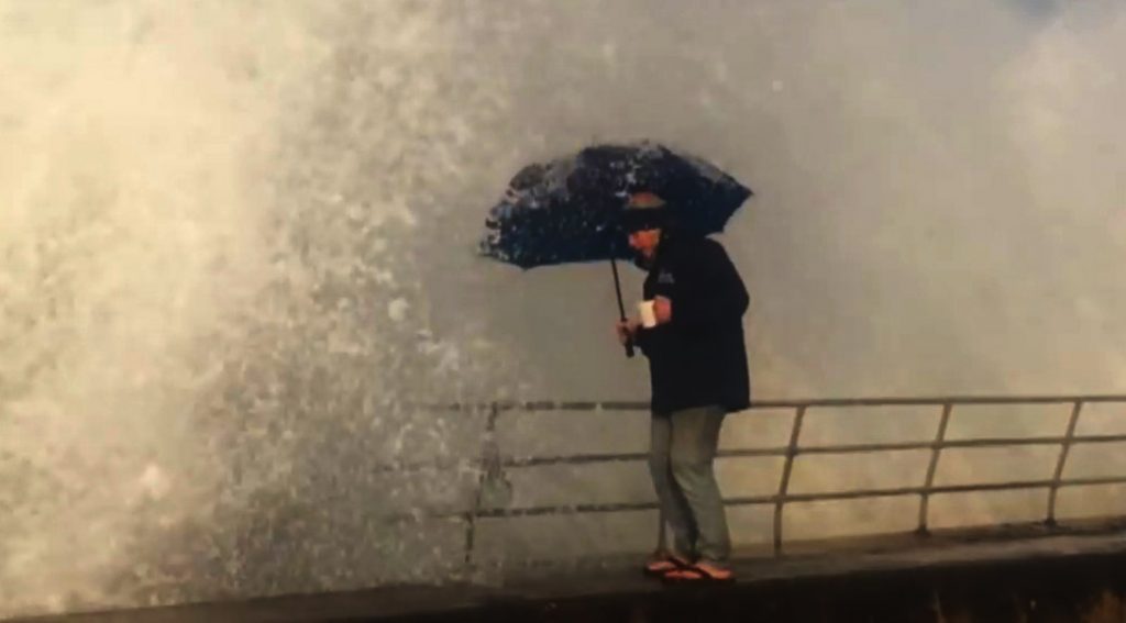Wave Soaks Woman After Umbrella Fail
