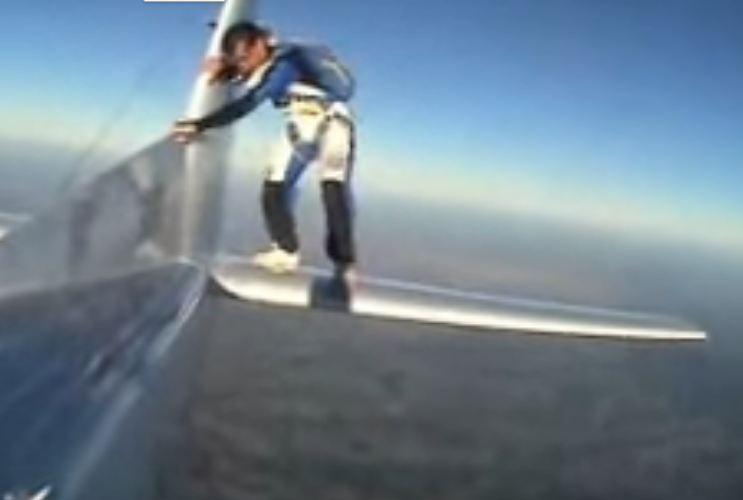 man skydive in plane