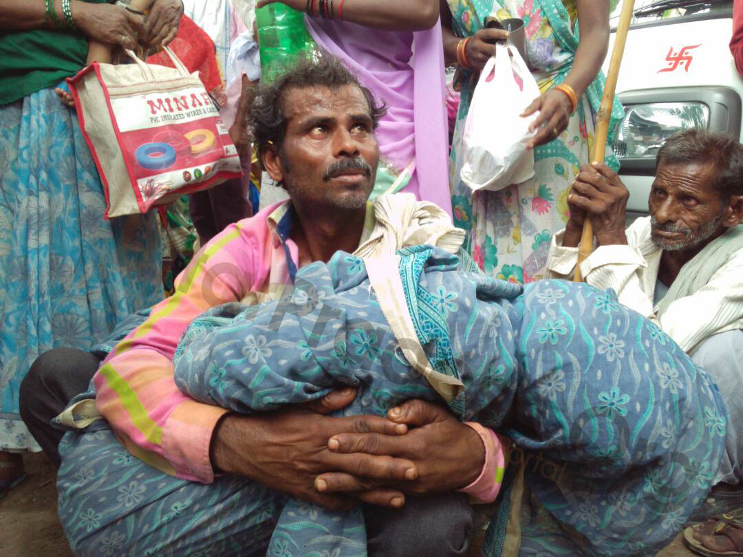 brother carries burnt sister on shoulder