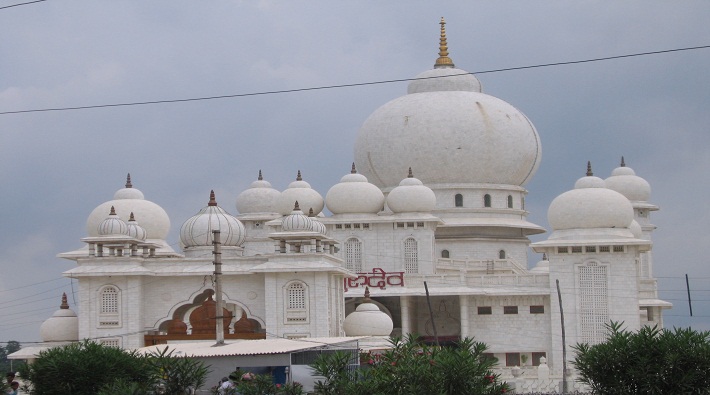 bulldozer on baba jai gurudev ashram illegal encroachment after hc order