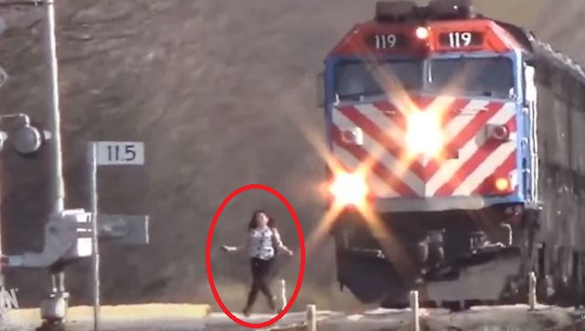 woman almost hitting train