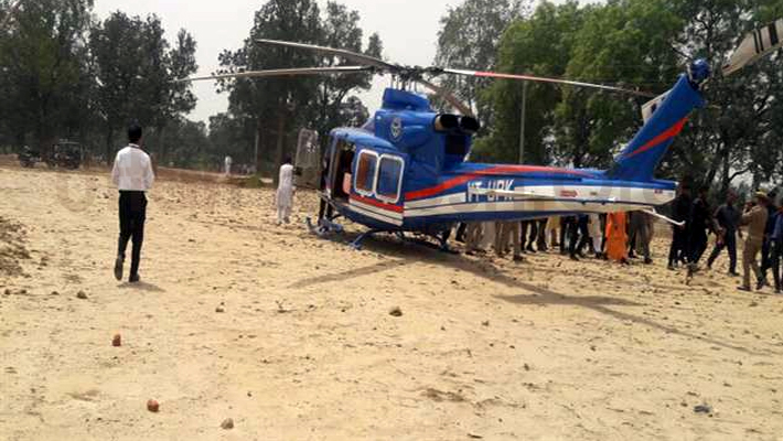 CM Yogi Helicopter landed at farm CM meets victims in kasganj
