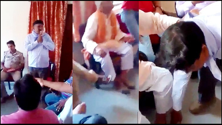 Dalit teacher forced to touch BJP Leader feet in police station