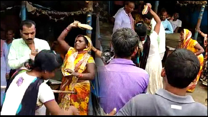 Women Beat Gram Pradhan With slippers and Lathi Video Viral