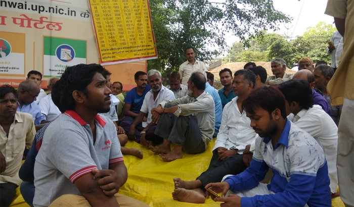 Allahabad: People sitting on protest against Subversion by ADA