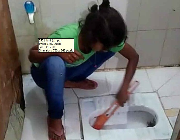 The task of cleanliness is done by the Small poor girl child.