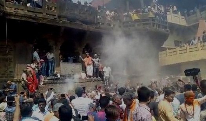 Holi played on the Manikarnika Ghat by the ash in Varanasi