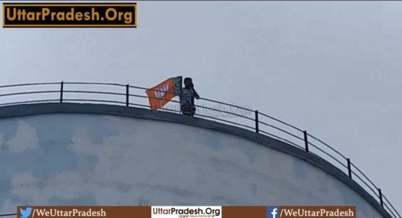 man-climbed-on-a-water-tank-carrying-bjp-flag